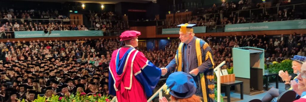 Dr Emily Ryall's Doctoral Student Receiving Award at University of Gloucestershire Graduation Ceremony